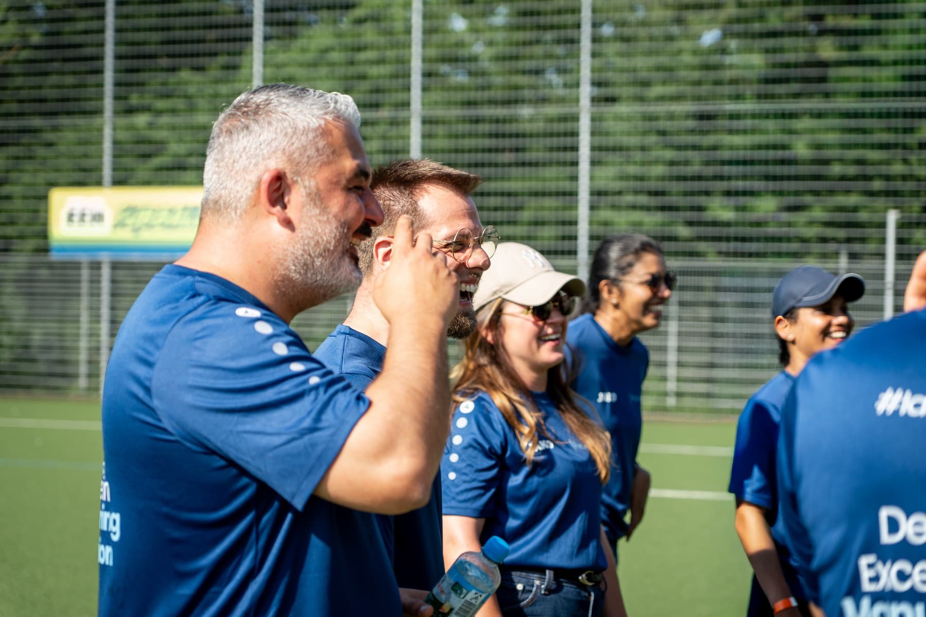 FrontWell colleagues laughing together during the summer team event.